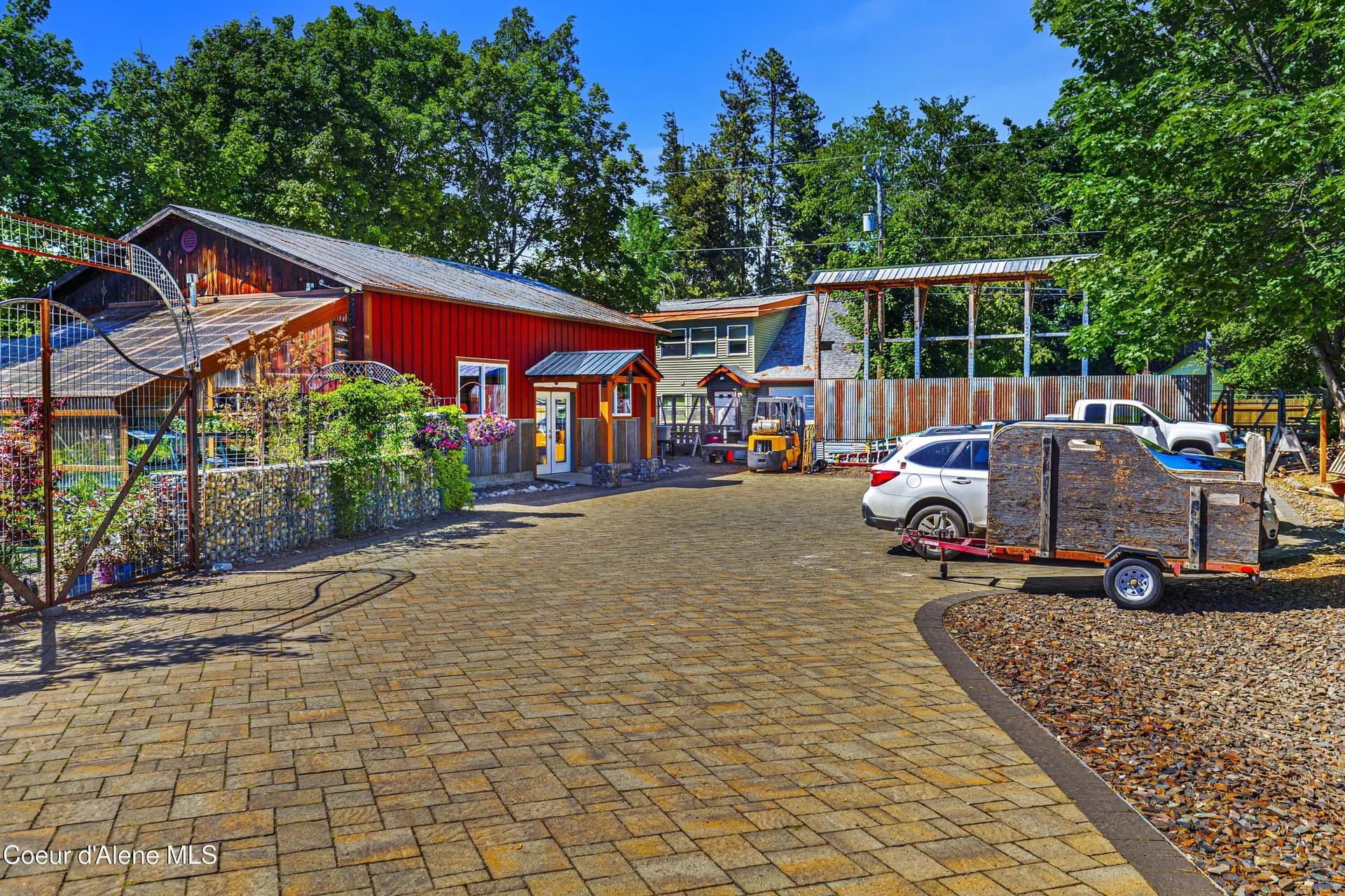 Aster Gardens - lush garden center with native pollinator-friendly plants, outdoor seating, and beautiful landscaping created by Paul and Karen Oleson